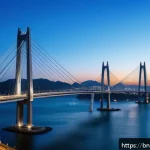 부산 광안대교 건설 히스토리 - A panoramic view of the Gwangan Bridge at dusk in Busan, South Korea, showcasing its modern architec...